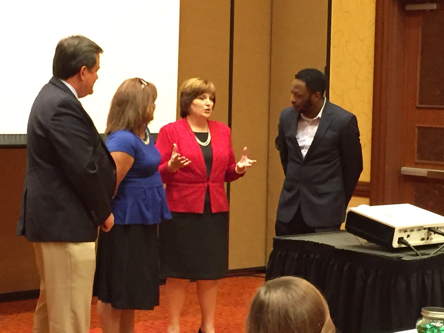 Susan discussing with conference members.