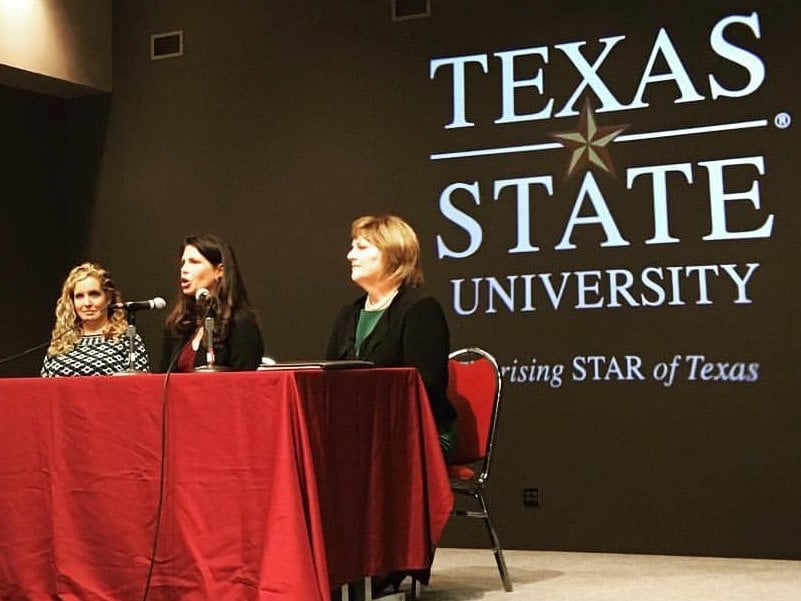 Susan speaking at a Texas State University panel.